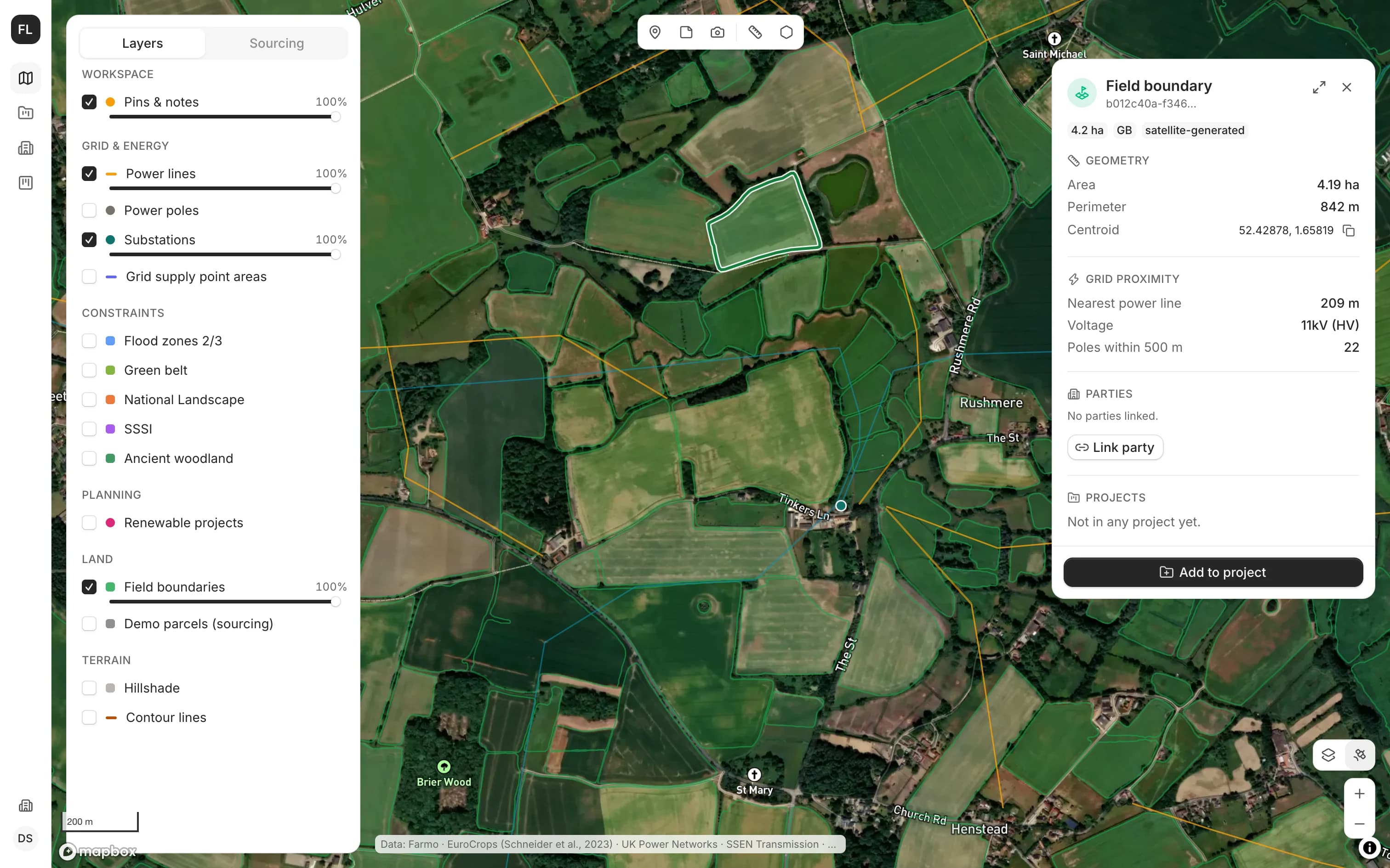 LandAreas in a browser: the layer list, fields and power lines over satellite imagery, and a selected field's area, perimeter and distance to the nearest power line.